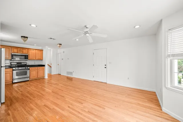 a view of kitchen with sink and microwave