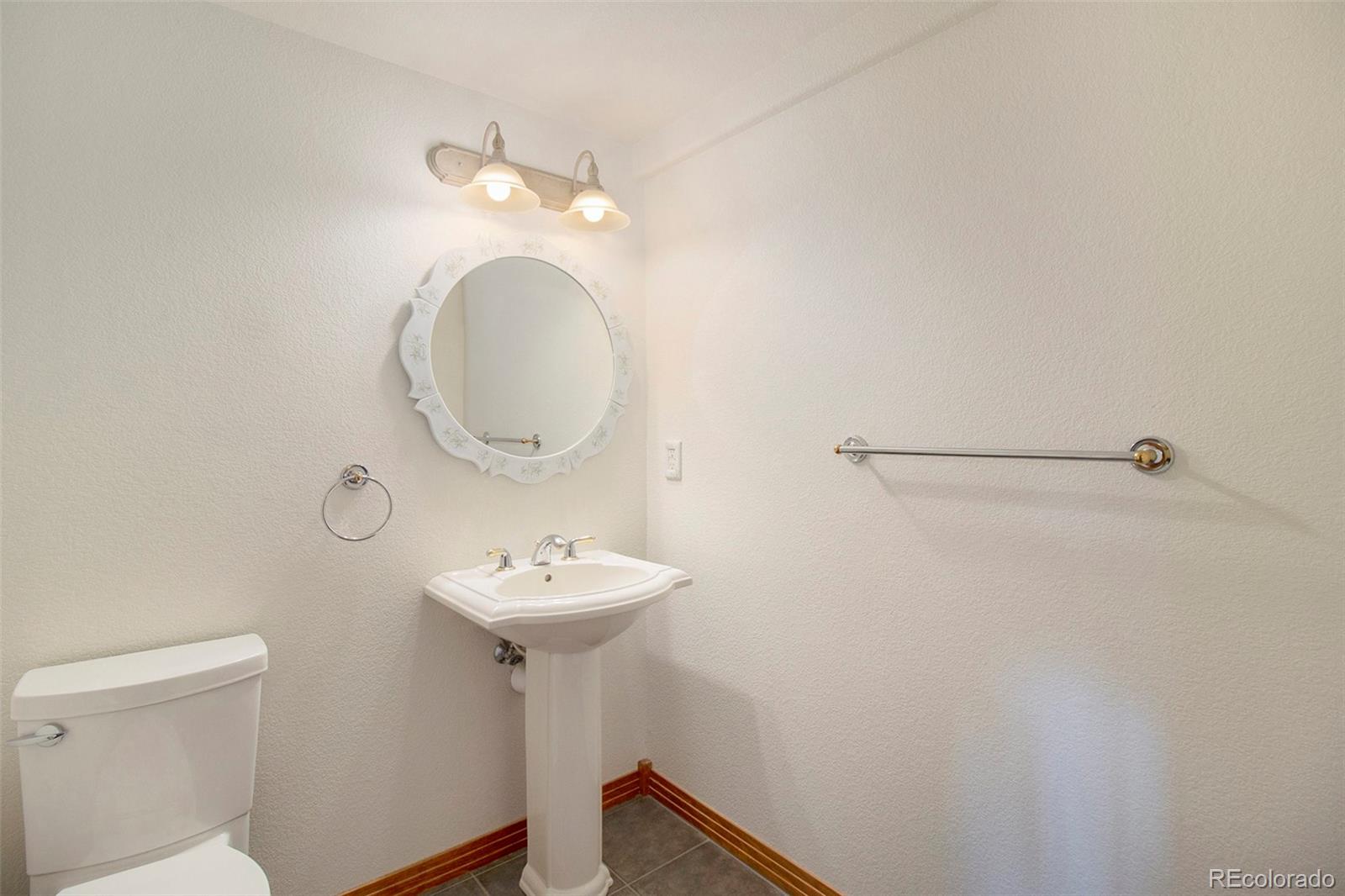 43 Forest Ridge Circle Bailey, CO 80421 - Photo 13 of 43 a bathroom with a sink mirror and toilet