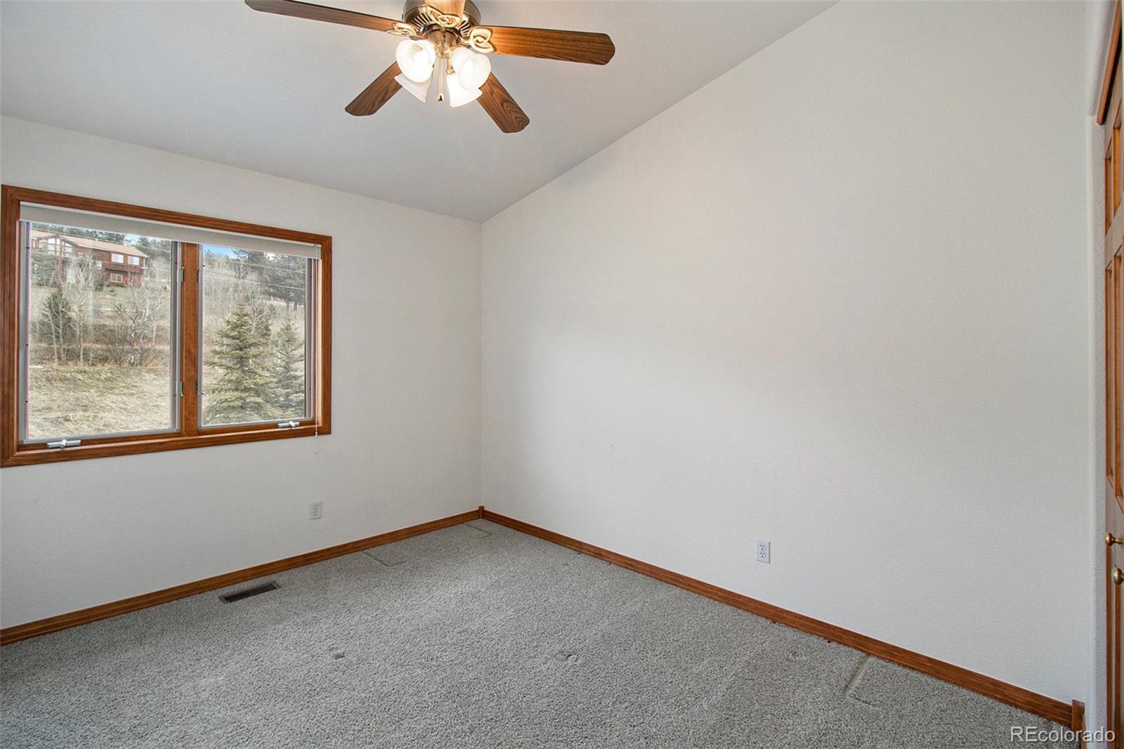 43 Forest Ridge Circle Bailey, CO 80421 - Photo 23 of 43 an empty room with a window