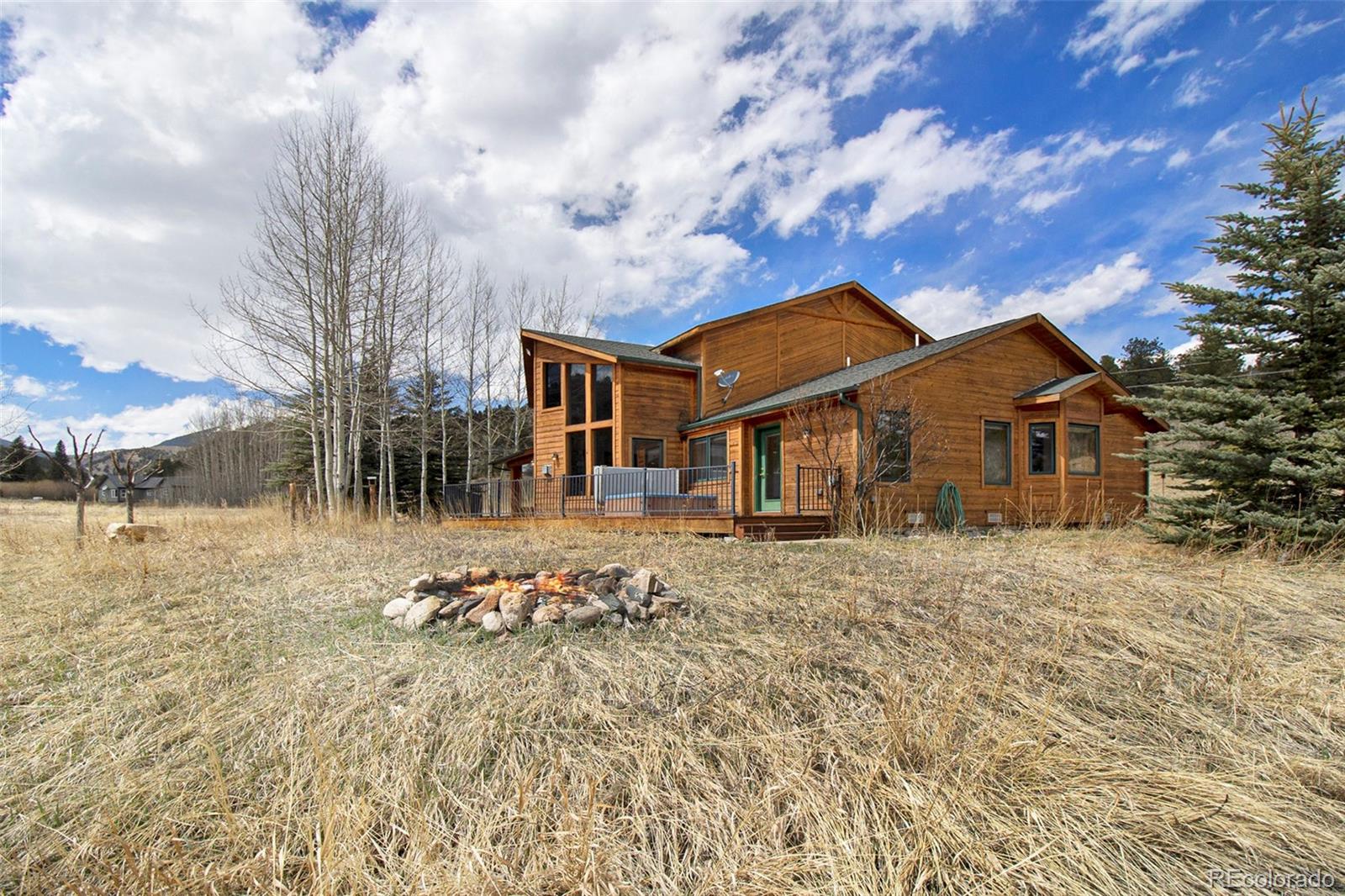 43 Forest Ridge Circle Bailey, CO 80421 - Photo 32 of 43 a front view of a house with a yard
