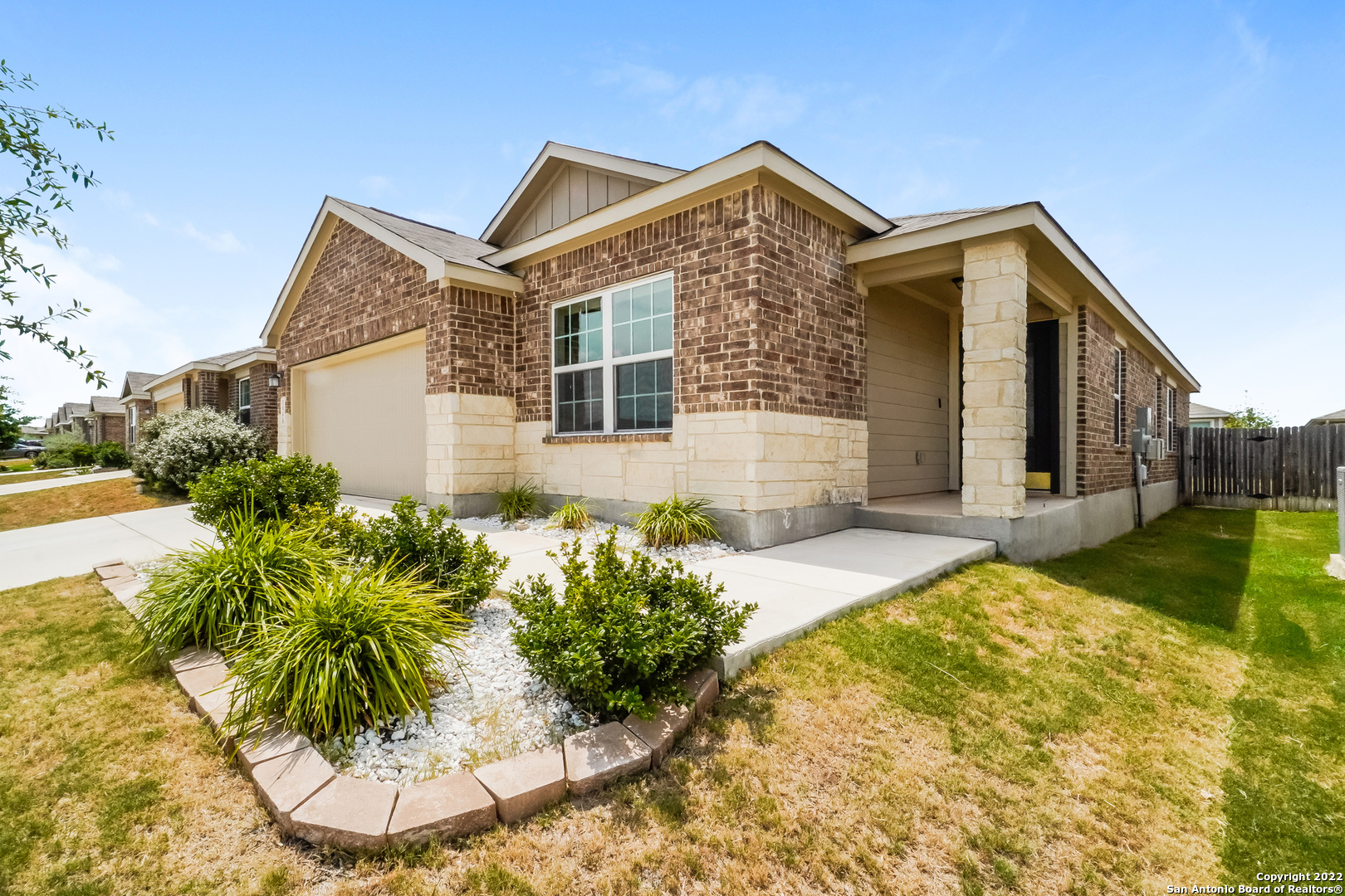 a front view of a house with garden