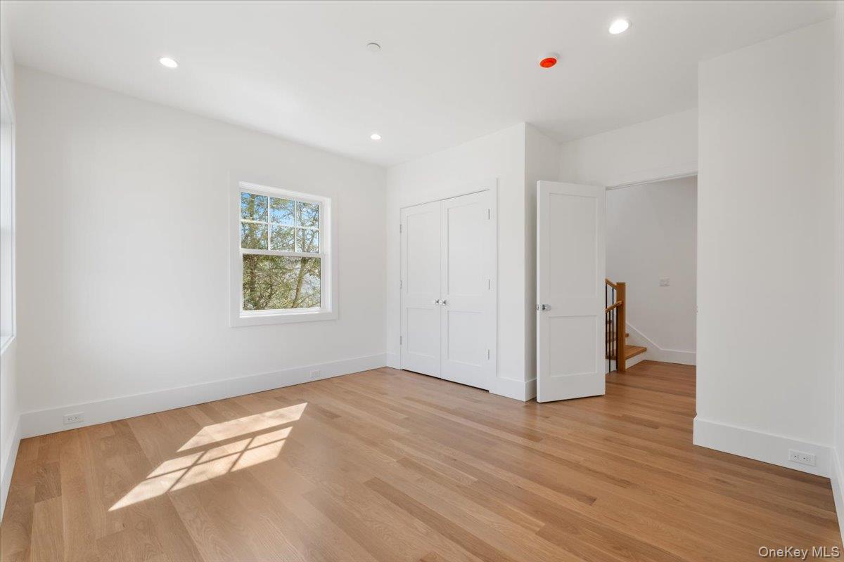 8 Dell Road Scarsdale, NY 10583 - Photo 17 of 41 wooden floor in an empty room with a window