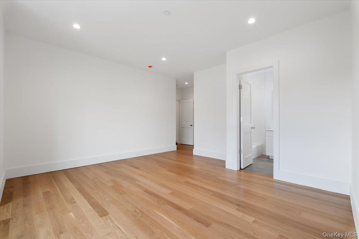 8 Dell Road Scarsdale, NY 10583 - Photo 21 of 41 a view of an empty room with wooden floor