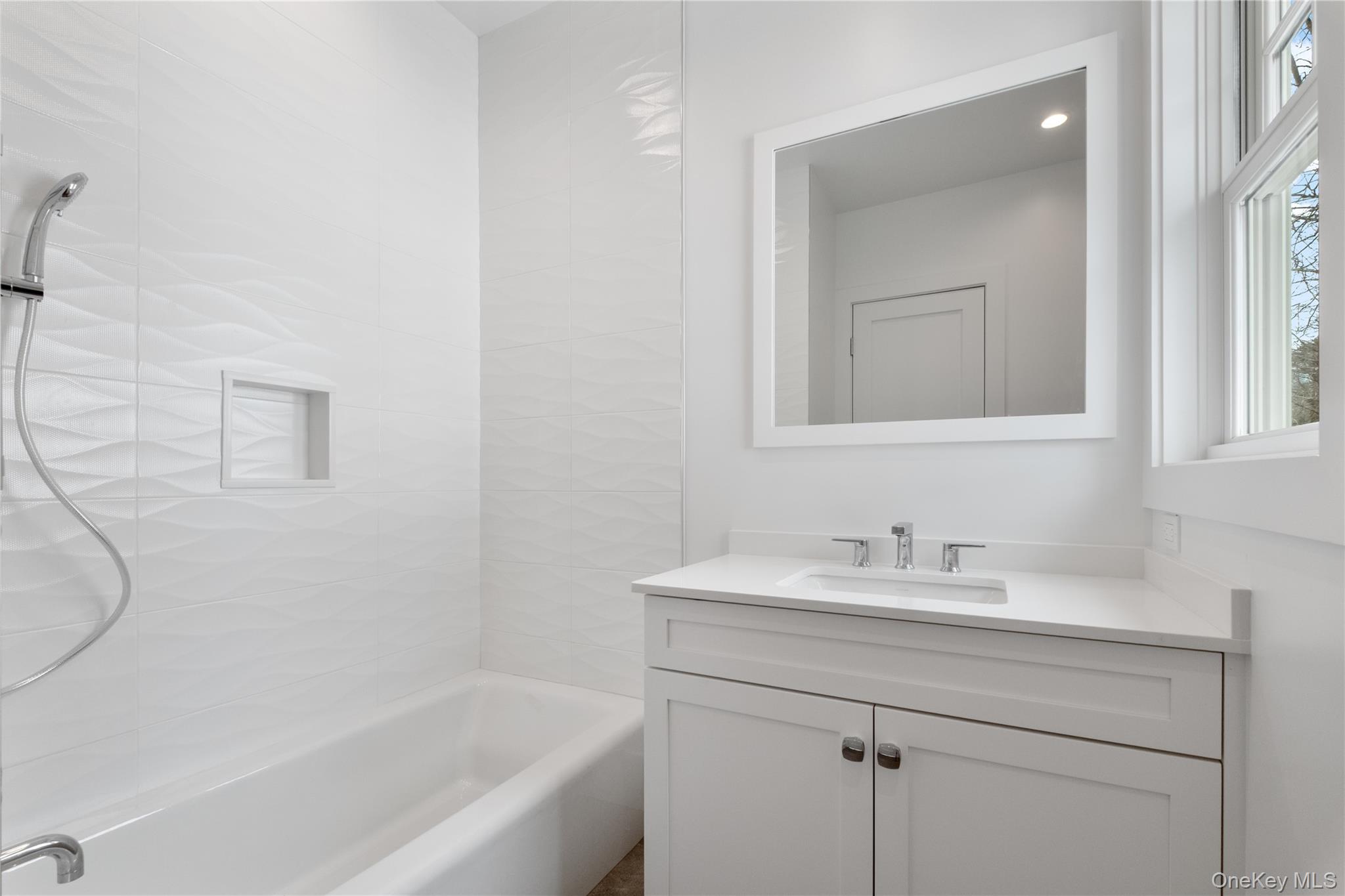 8 Dell Road Scarsdale, NY 10583 - Photo 22 of 41 a bathroom with a sink and a bathtub