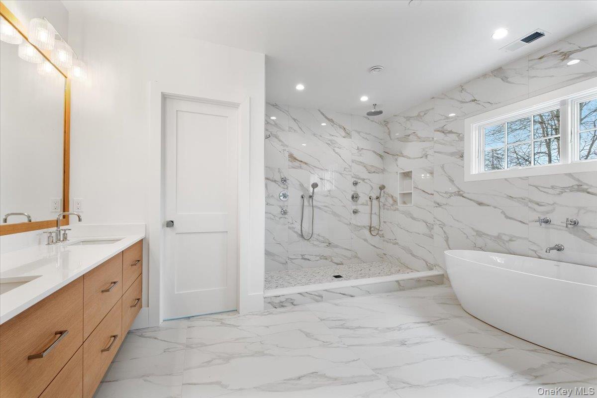 8 Dell Road Scarsdale, NY 10583 - Photo 26 of 41 a bathroom with a bathtub sink and toilet