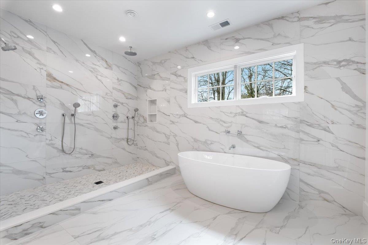 8 Dell Road Scarsdale, NY 10583 - Photo 27 of 41 a spacious bathroom with a bathtub and shower