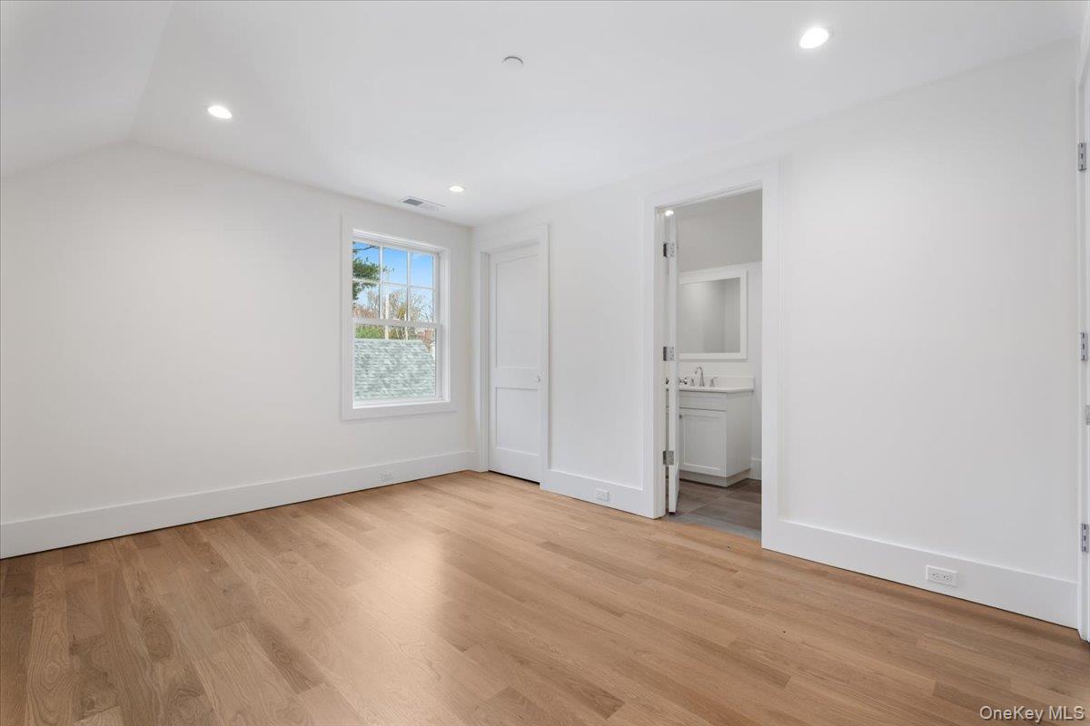 8 Dell Road Scarsdale, NY 10583 - Photo 30 of 41 wooden floor in an empty room with a window