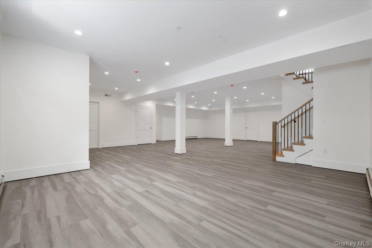 8 Dell Road Scarsdale, NY 10583 - Photo 32 of 41 a view of empty room with wooden floor