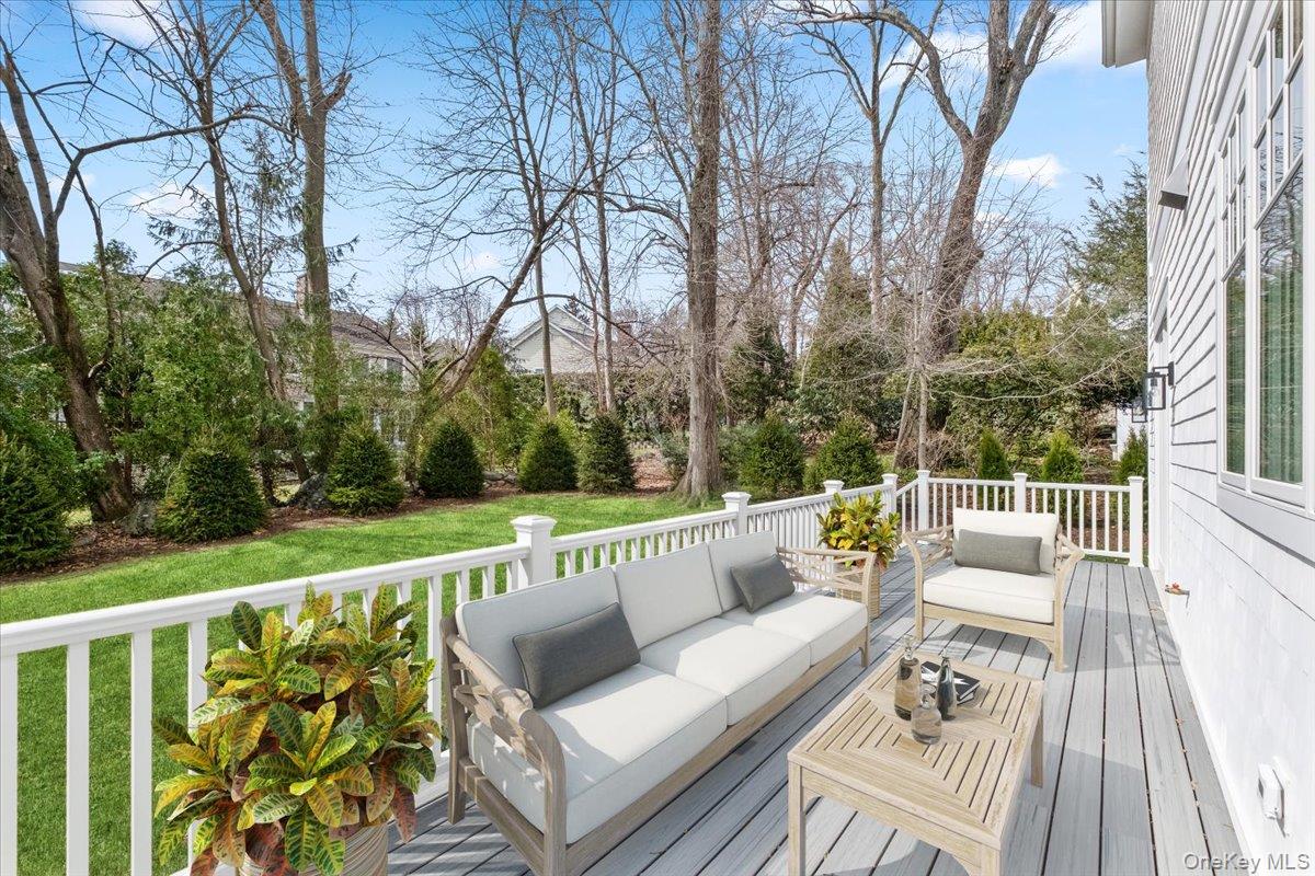 8 Dell Road Scarsdale, NY 10583 - Photo 37 of 41 a balcony with wooden floor and outdoor seating