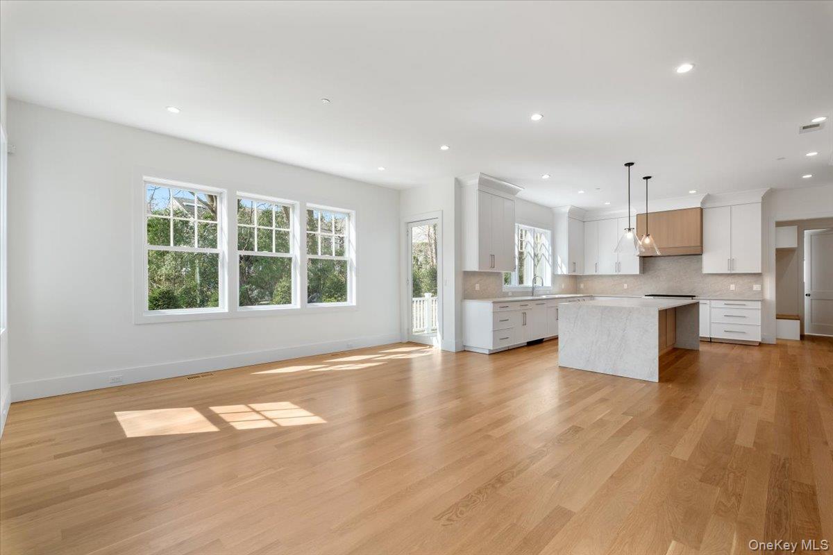 8 Dell Road Scarsdale, NY 10583 - Photo 10 of 41 a view of kitchen with wooden floor and windows