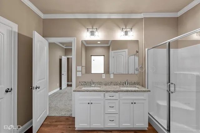 a bathroom with a granite countertop sink mirror and double