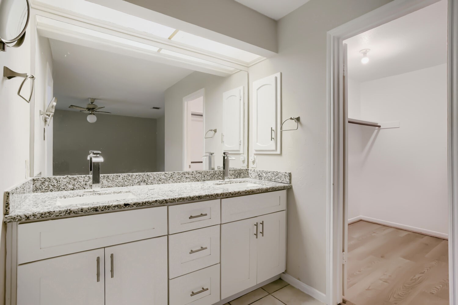 10103 Inwood Shadows Street Houston, TX 77088 - Photo 19 of 32 a bathroom with a granite countertop sink double and mirror