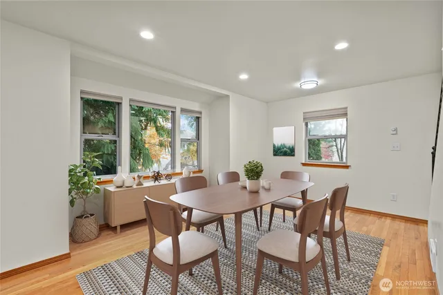 a view of a dining room with furniture window and outside view