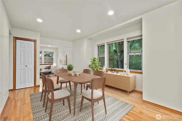 a dining room with furniture and window