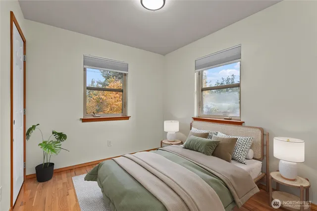 a bedroom with a bed and a window