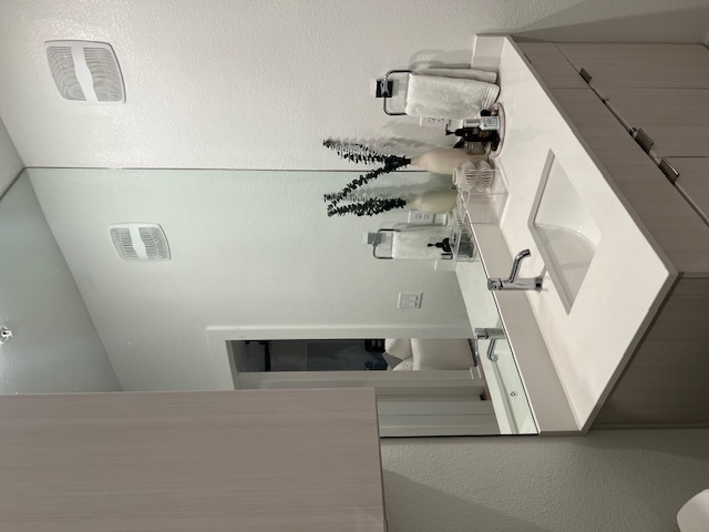 4802 South Congress Avenue, Unit 121 Austin, TX 78745 - Photo 13 of 38 a bathroom with a sink and a mirror
