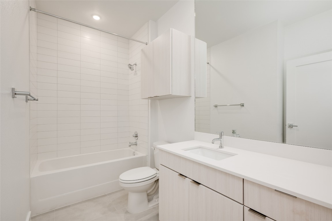 4802 South Congress Avenue, Unit 121 Austin, TX 78745 - Photo 23 of 38 a bathroom with a sink a toilet and shower