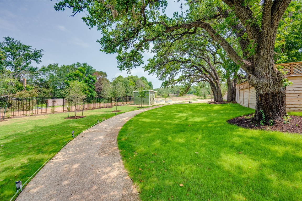 4802 South Congress Avenue, Unit 121 Austin, TX 78745 - Photo 29 of 38 a huge green field with lots of trees