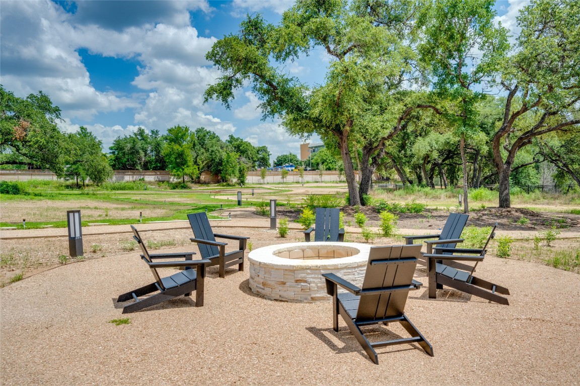 4802 South Congress Avenue, Unit 121 Austin, TX 78745 - Photo 34 of 38 a view of a swimming pool and lounge chairs