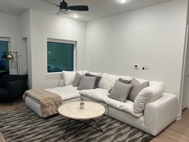4802 South Congress Avenue, Unit 121 Austin, TX 78745 - Photo 10 of 38 a living room with furniture and a chandelier