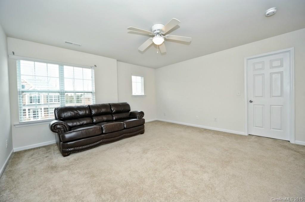 9927 Paxton Run Road Charlotte, NC 28277 - Photo 11 of 24 a living room with furniture and a large window