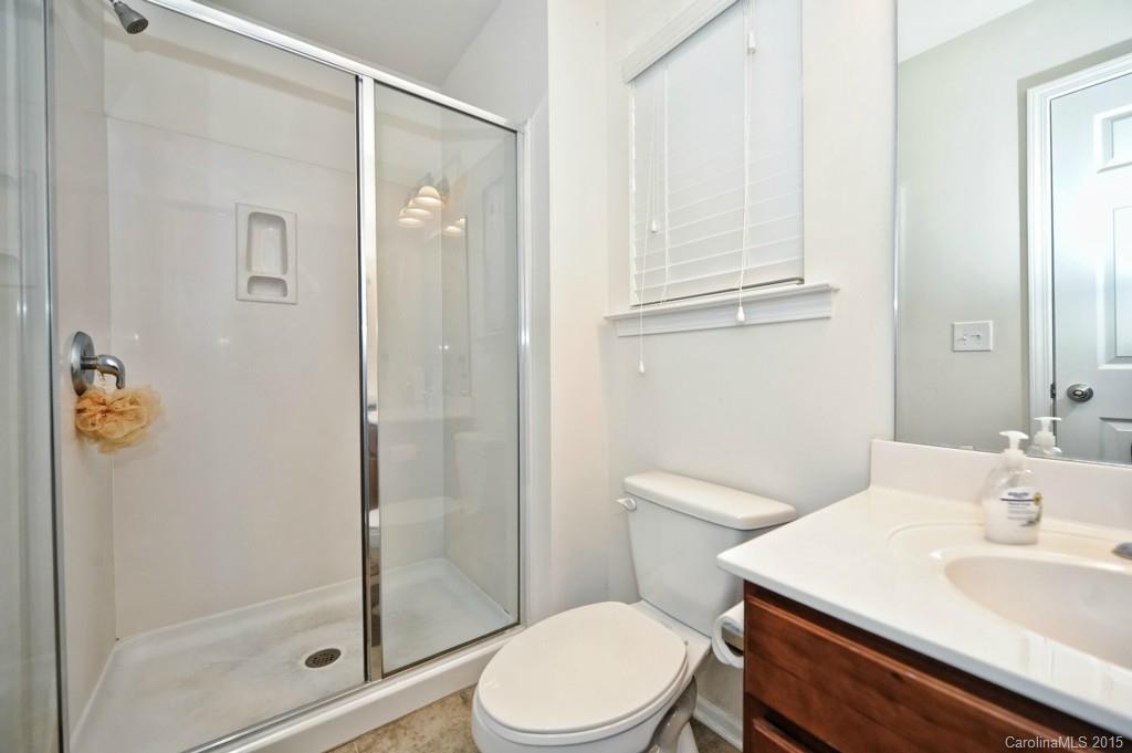 9927 Paxton Run Road Charlotte, NC 28277 - Photo 18 of 24 a bathroom with a sink a toilet and shower