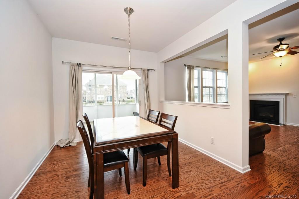 9927 Paxton Run Road Charlotte, NC 28277 - Photo 8 of 24 a view of a dining room with furniture window and wooden floor