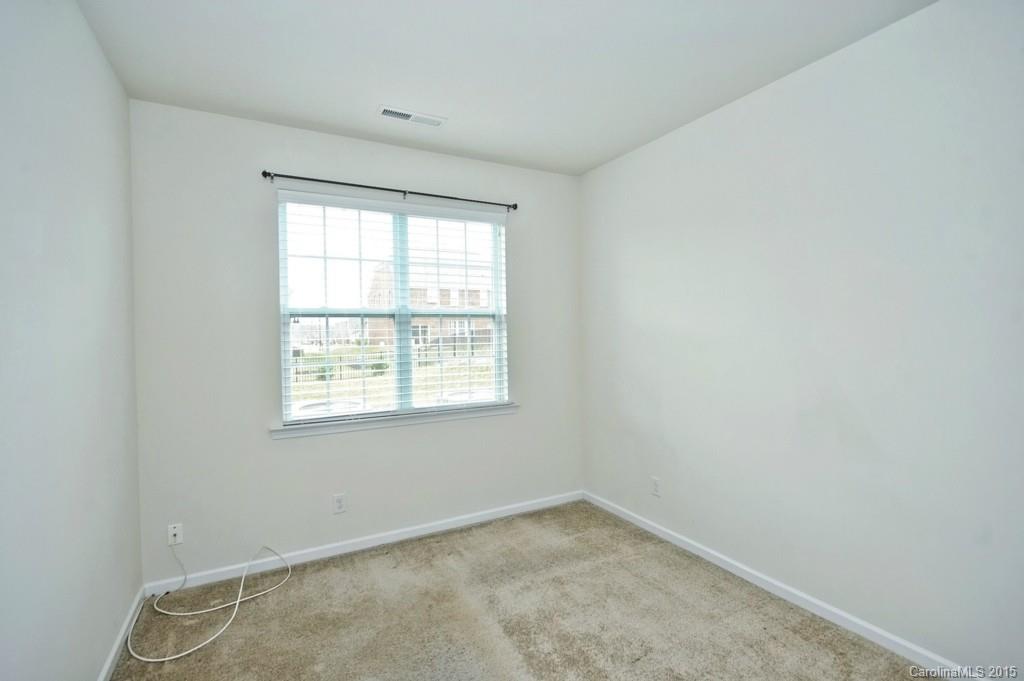 9927 Paxton Run Road Charlotte, NC 28277 - Photo 9 of 24 an empty room with a window