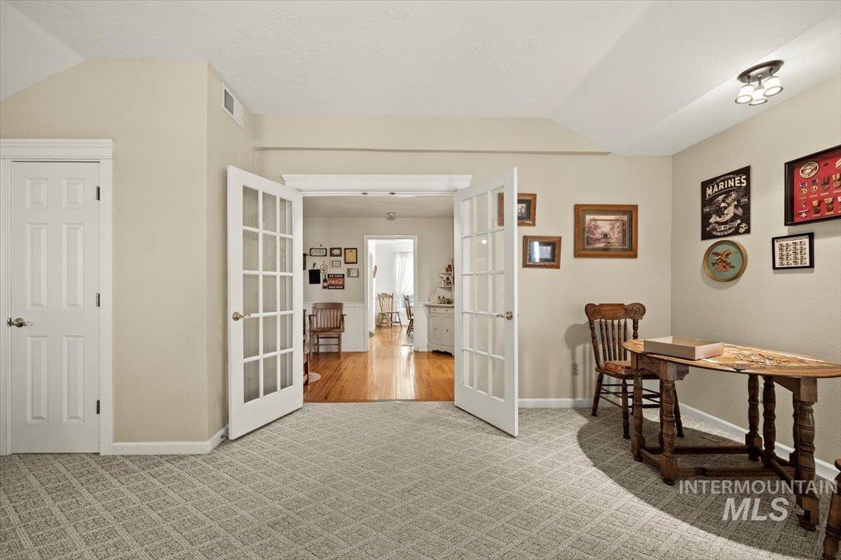 7425 Robinson Road Kuna, ID 83634 - Photo 19 of 50 Carpeted office with french doors and lofted ceiling