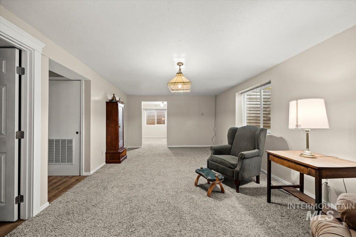7425 Robinson Road Kuna, ID 83634 - Photo 41 of 50 Living area featuring baseboards and carpet floors