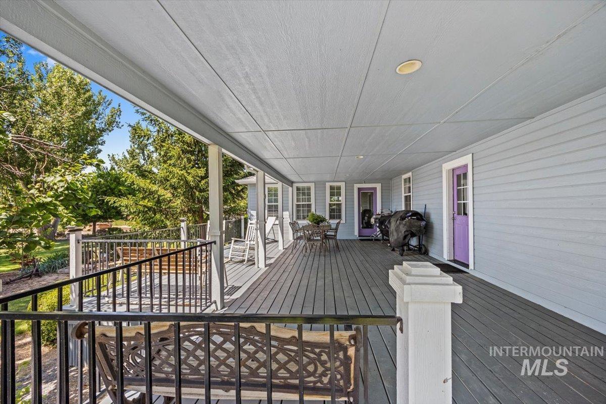 7425 Robinson Road Kuna, ID 83634 - Photo 45 of 50 Wooden terrace with outdoor dining area