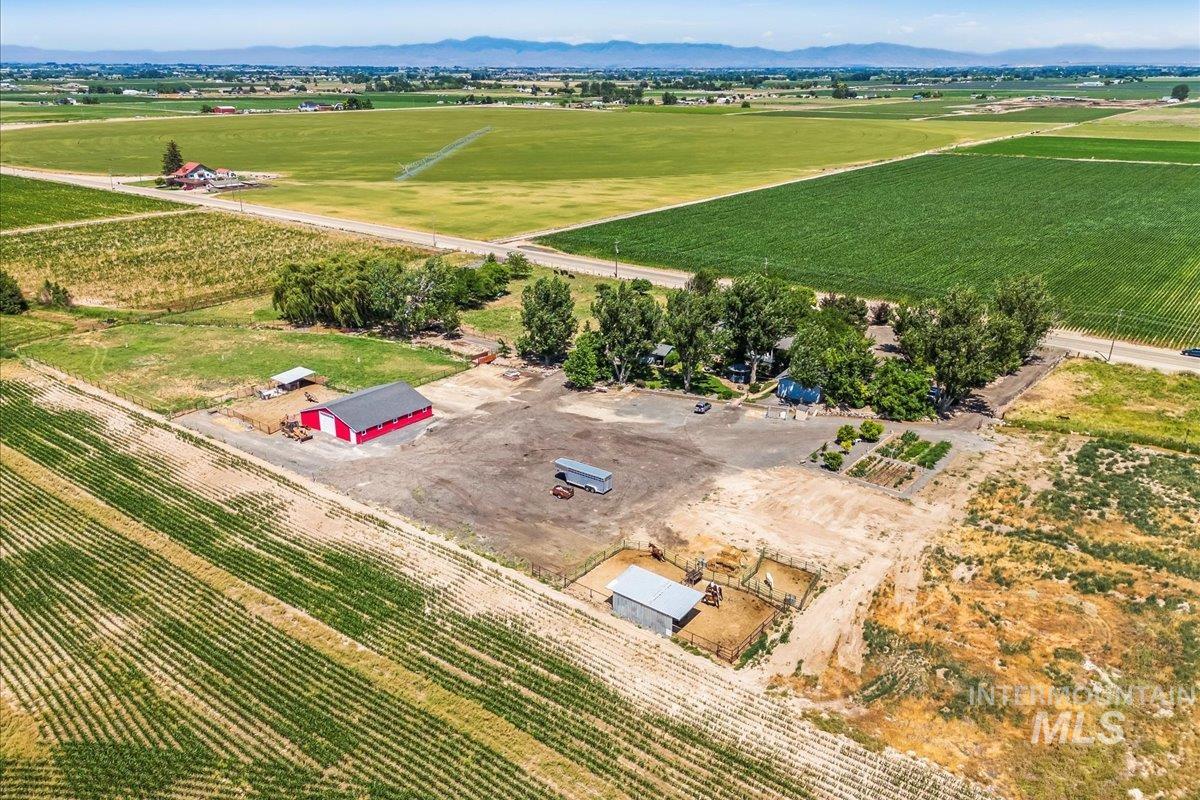 7425 Robinson Road Kuna, ID 83634 - Photo 7 of 50 View of rural area featuring extensive farmland and a mountain backdrop