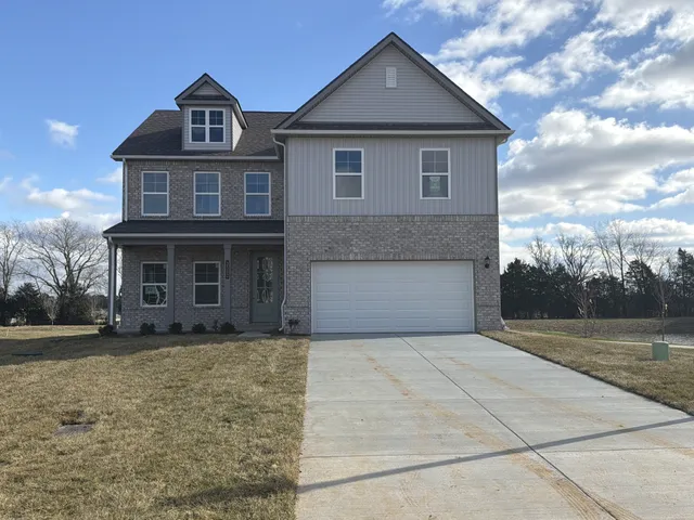 a front view of a house with yard