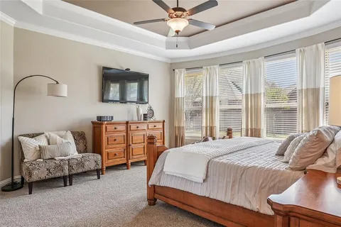 a bedroom with furniture and a window