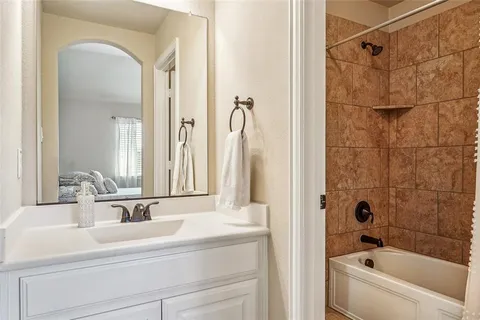 a bathroom with a bathtub and a sink
