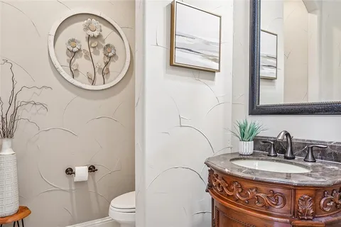 a bathroom with a toilet and a sink