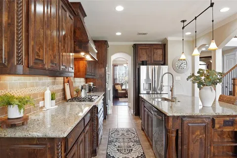 a kitchen with counter top space cabinets and appliances
