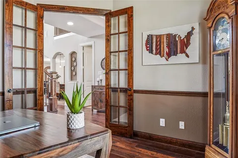 a view of an entryway with wooden floor