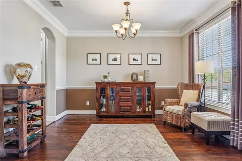 a living room with furniture a rug and a window