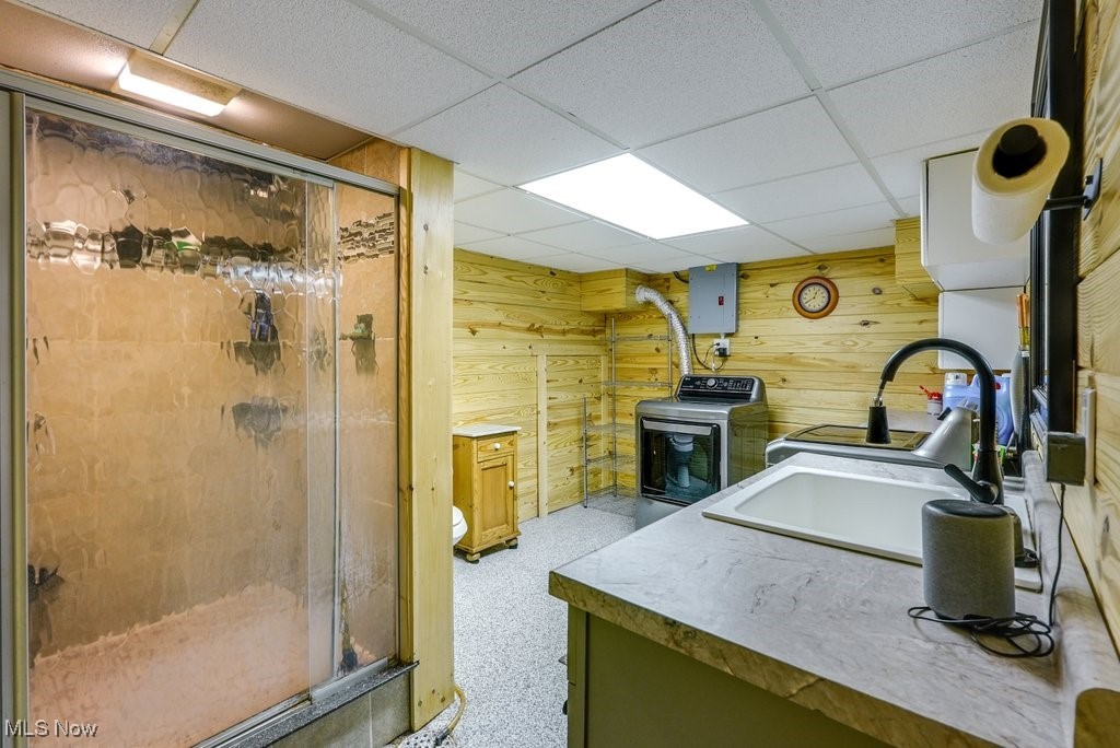 4220 Lake Heights Road Northwest Canton, OH 44708 - Photo 28 of 48 Full bath featuring vanity, a walk in shower, wooden walls, and washer / clothes dryer