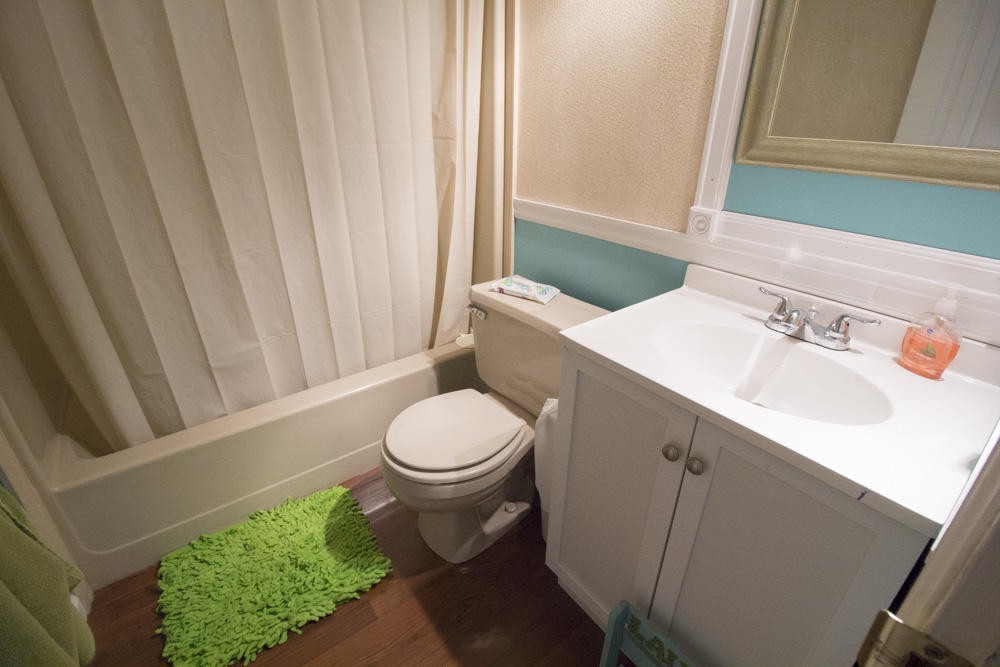 112 Delmar Circle Oak Ridge, TN 37830 - Photo 11 of 32 a bathroom with a toilet a sink and a window