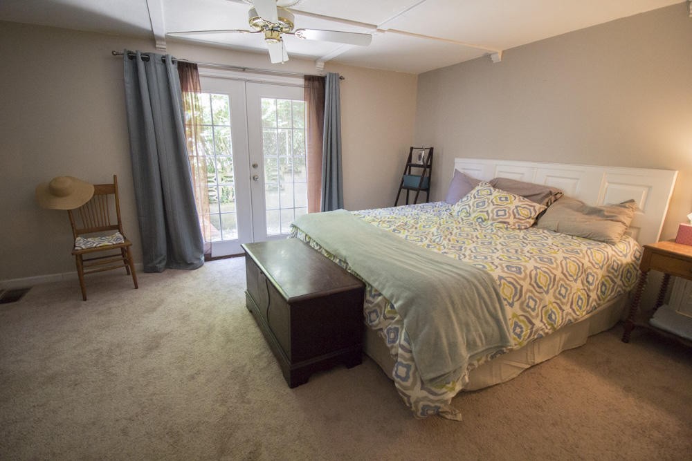 112 Delmar Circle Oak Ridge, TN 37830 - Photo 12 of 32 a bed sitting in a spacious bedroom next to a window