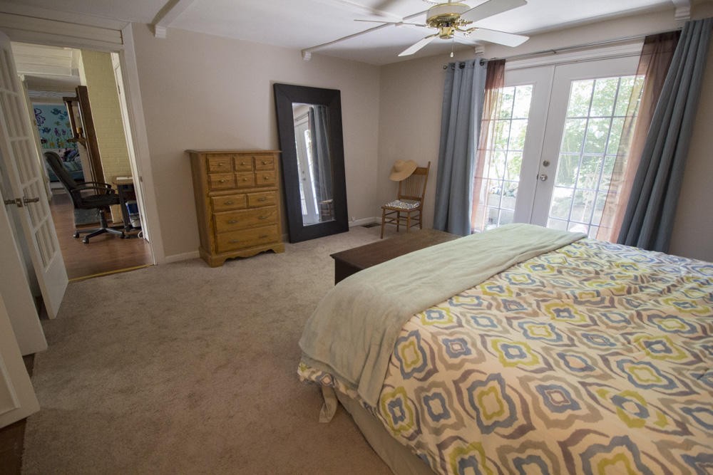112 Delmar Circle Oak Ridge, TN 37830 - Photo 13 of 32 a spacious bedroom with a bed and a walk in closet