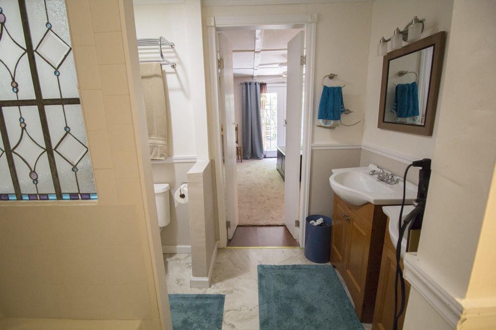 112 Delmar Circle Oak Ridge, TN 37830 - Photo 15 of 32 a bathroom with sink a mirror a bathtub and shower
