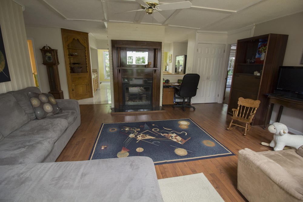 112 Delmar Circle Oak Ridge, TN 37830 - Photo 29 of 32 a living room with furniture rug and a flat screen tv