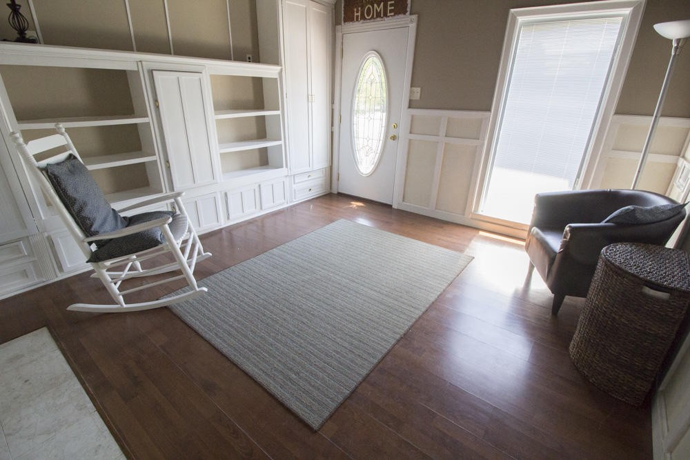 112 Delmar Circle Oak Ridge, TN 37830 - Photo 5 of 32 an empty room with wooden floor and windows