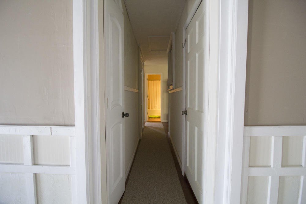 112 Delmar Circle Oak Ridge, TN 37830 - Photo 7 of 32 a view of a hallway with a white cabinet