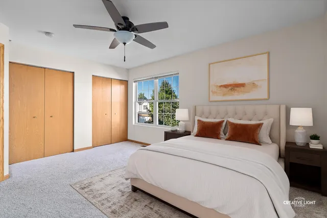 a bedroom with a large bed and a window