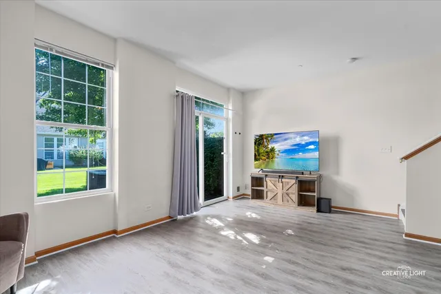 an empty room with furniture and a window