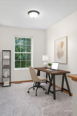 a workspace with furniture and a window